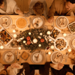 Family gathered around a table preparing to enjoy a holiday meal